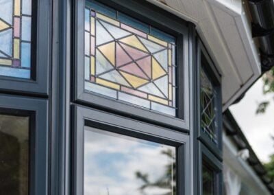 Leaded stained glass in dark blue window frames, Windows Etc Colchester