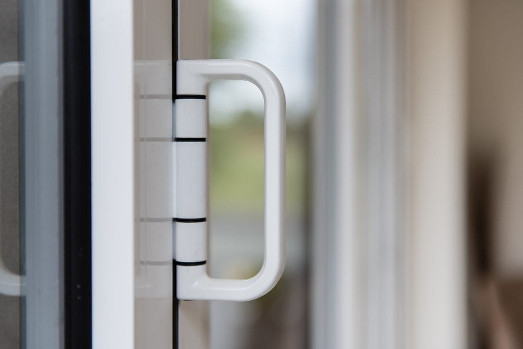 Exterior view of L-shaped extension with aluminium bifold doors