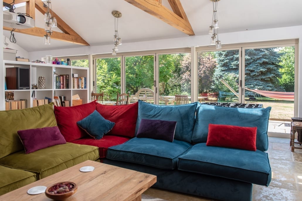 Bifold doors partially open showing traffic door configuration
