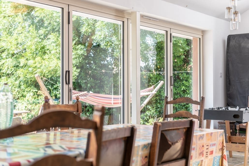 Garden view towards house with bifold doors open, South Ipswich