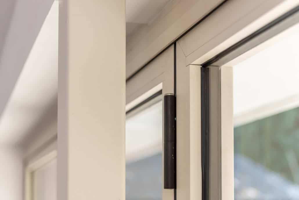 Interior looking out through open bifold doors to garden space