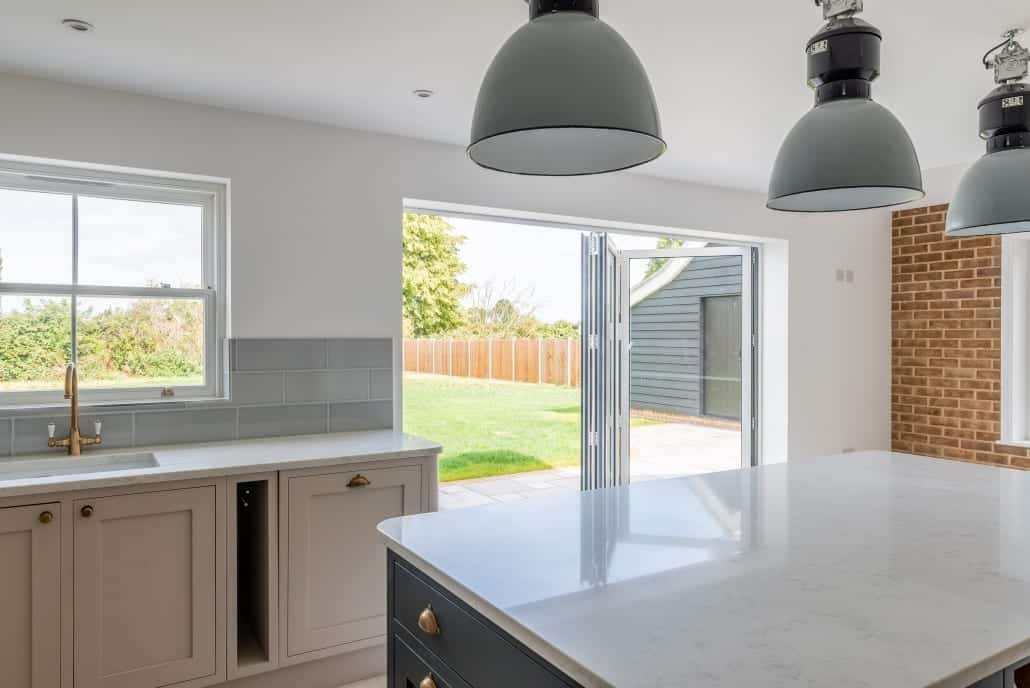 Rear garden elevation with Smarts aluminium bifold doors in 3-3-0 configuration