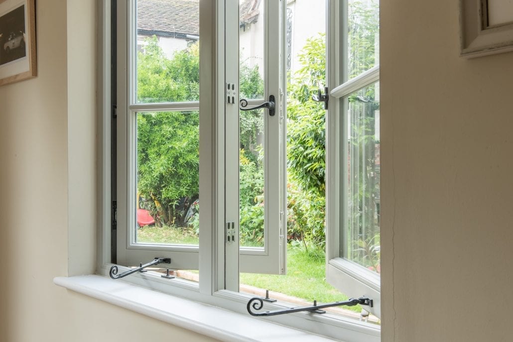 Bereco timber casement window with garden view, Dedham Essex