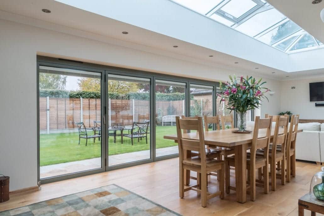 aïr bifold doors and full-length lantern roof spanning the width of a rear extension