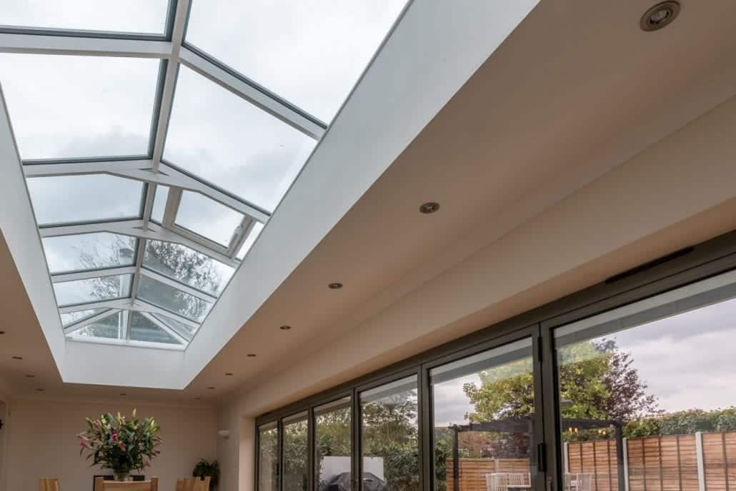 Garden room with bifold doors and overhead lantern roof