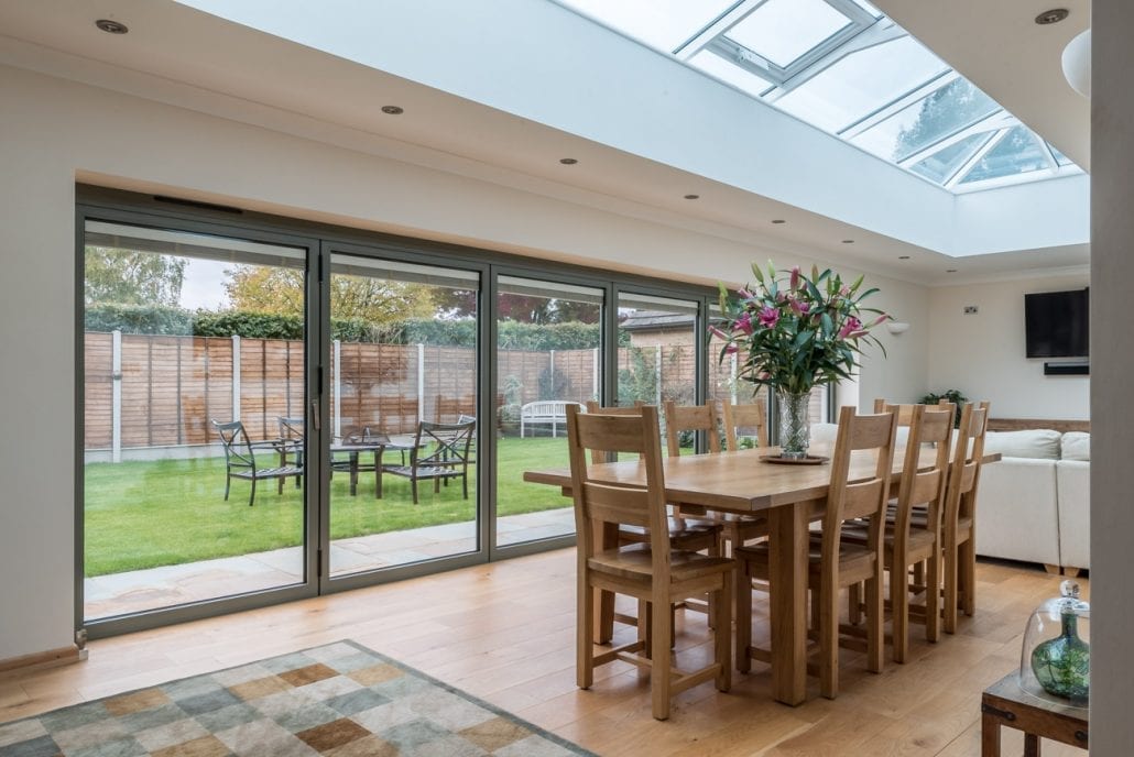 aïr bifold doors open to the garden with lantern roof above