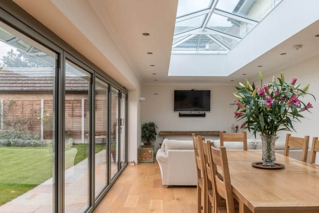 aïr bifold doors partially open showing garden access
