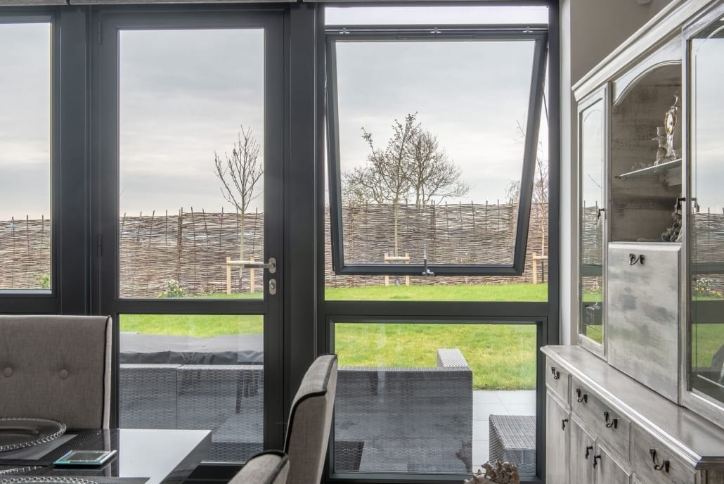 Close-up of a grey Origin aluminium window corner and internal reveal