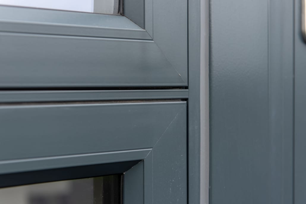 Close-up of a grey Origin aluminium frame and glazing bead detail