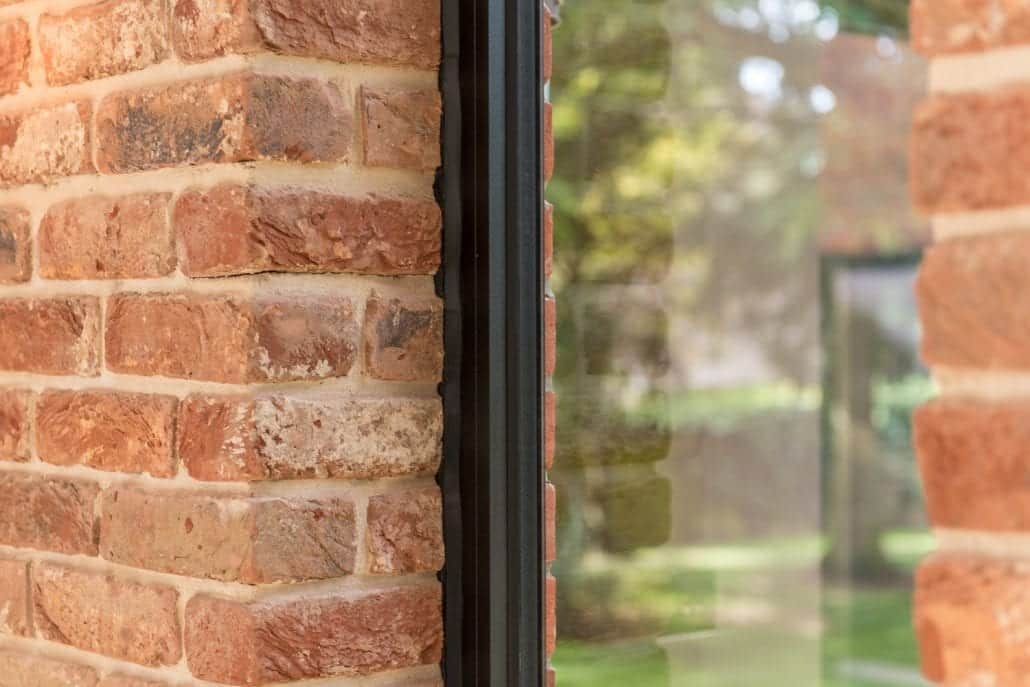 Bifold doors fully open showing uninterrupted garden views from the rear extension