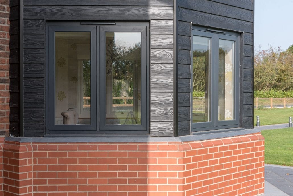 Exterior view of the renovated Essex village property with flush sash windows