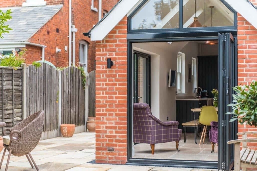 Aluminium bifold doors open to garden, Colchester Edwardian project