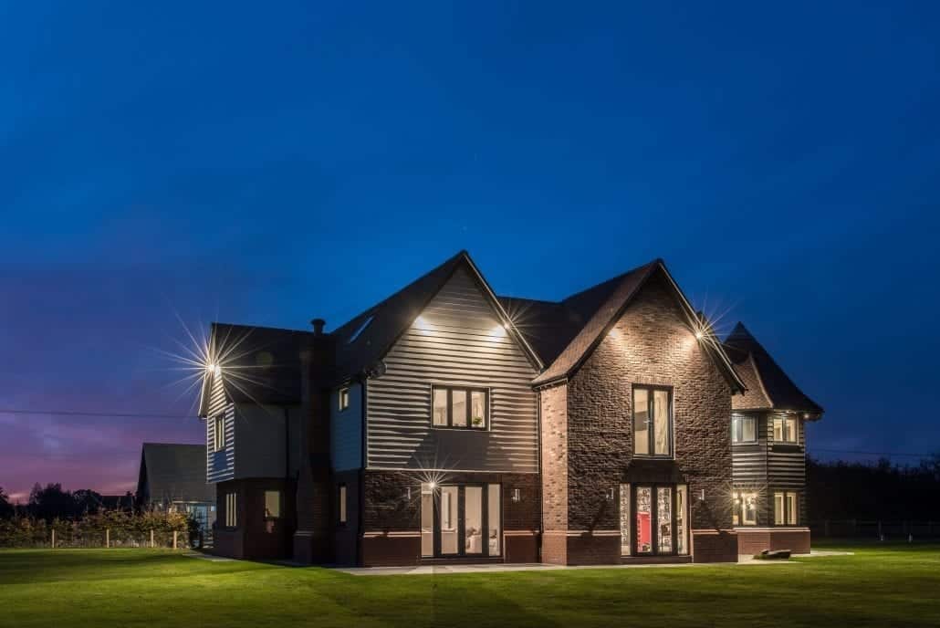 Exterior view of an Essex village renovation project featuring flush sash windows and bifold doors