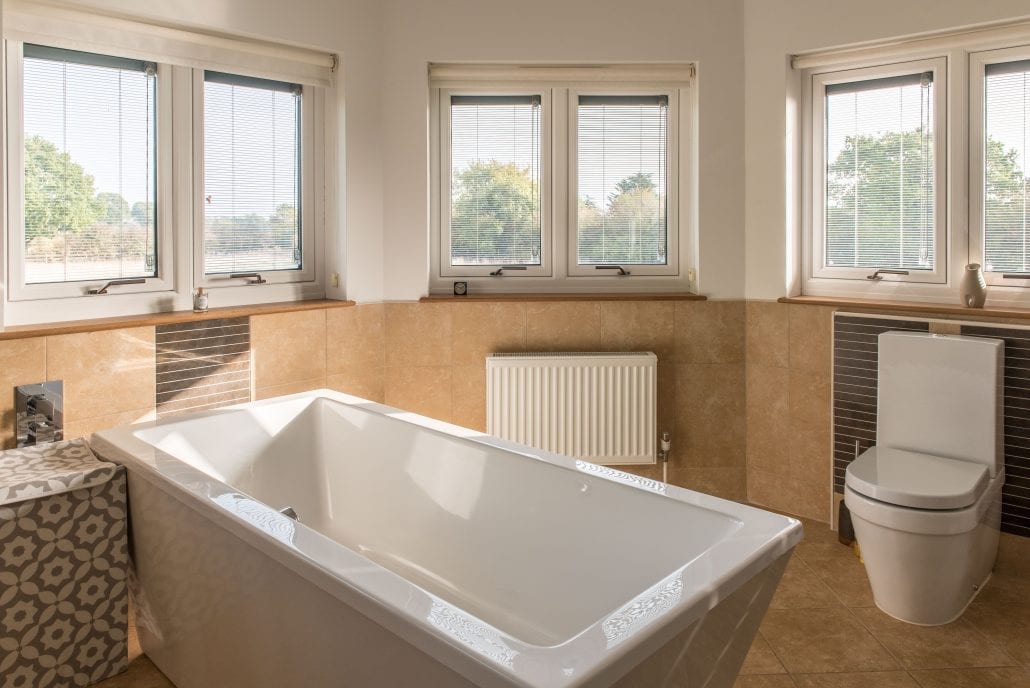 Upstairs bathroom glazing with internal Venetian blinds for privacy