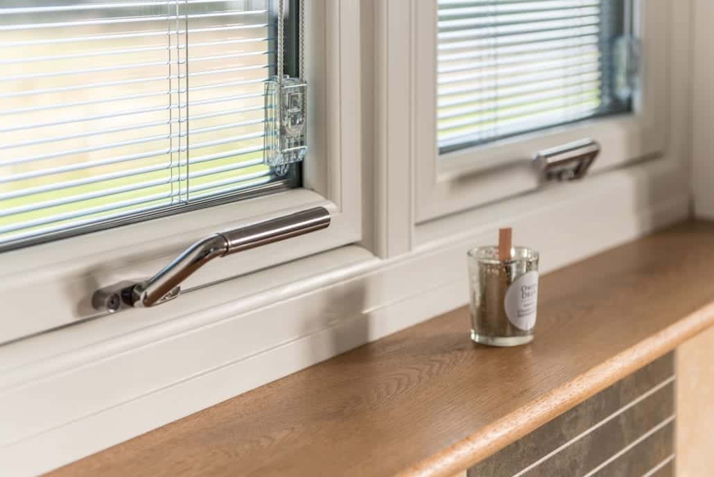 Flush sash windows on the upper floor of the Essex village house