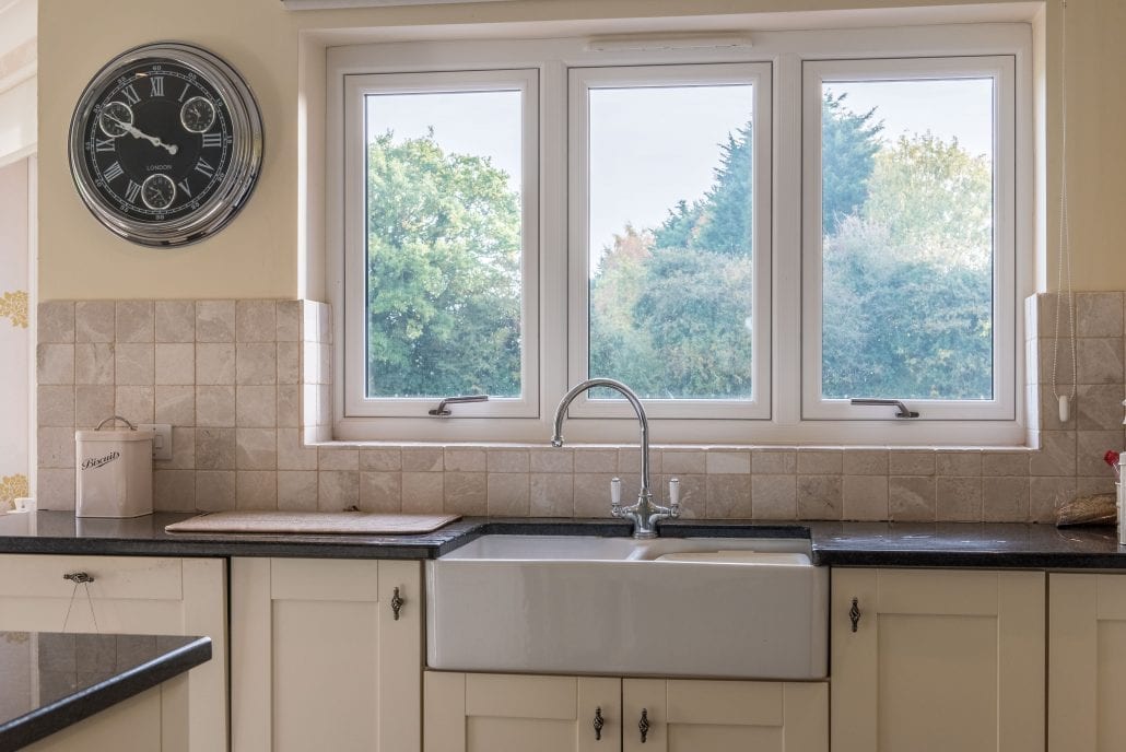 Flush sash windows with anthracite exterior and white interior finish