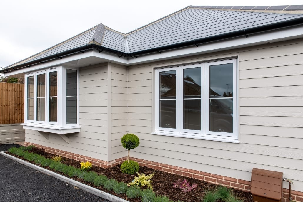 Duraflex flush sash windows, smooth white uPVC on residential property