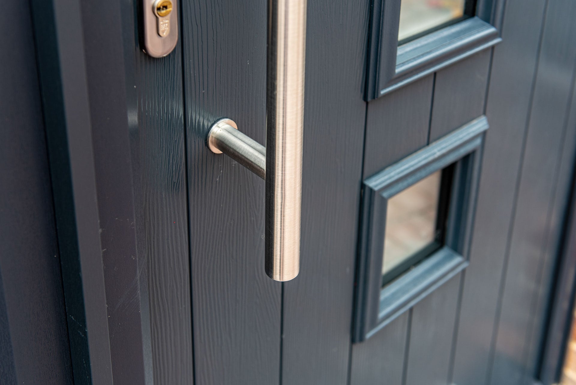 Smarts bi-folding doors in RAL7038 Agate Grey opening to the rear garden of a Suffolk property
