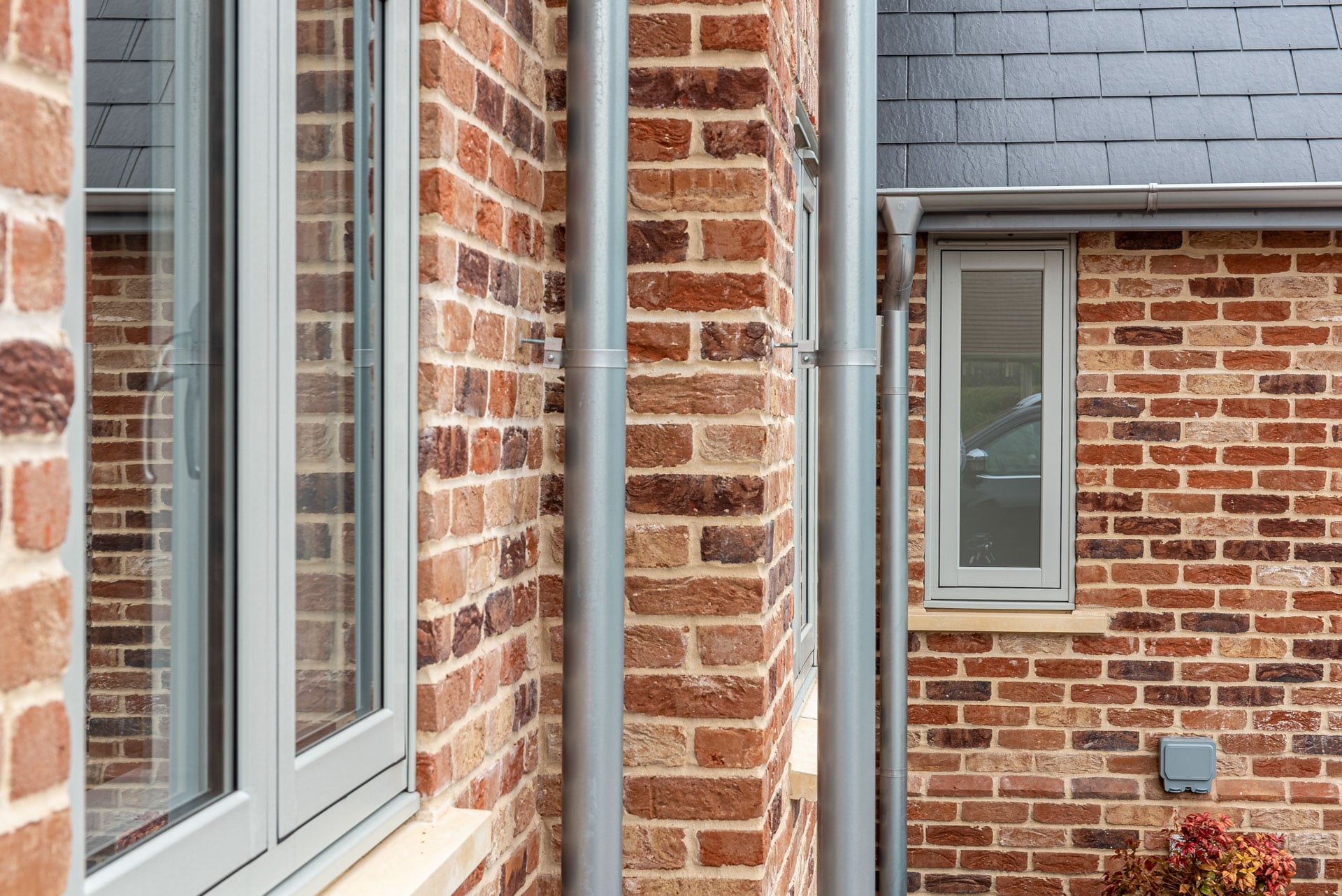 Detail of VEKA Halo window mechanical joints in Agate Grey on Whitegrain finish