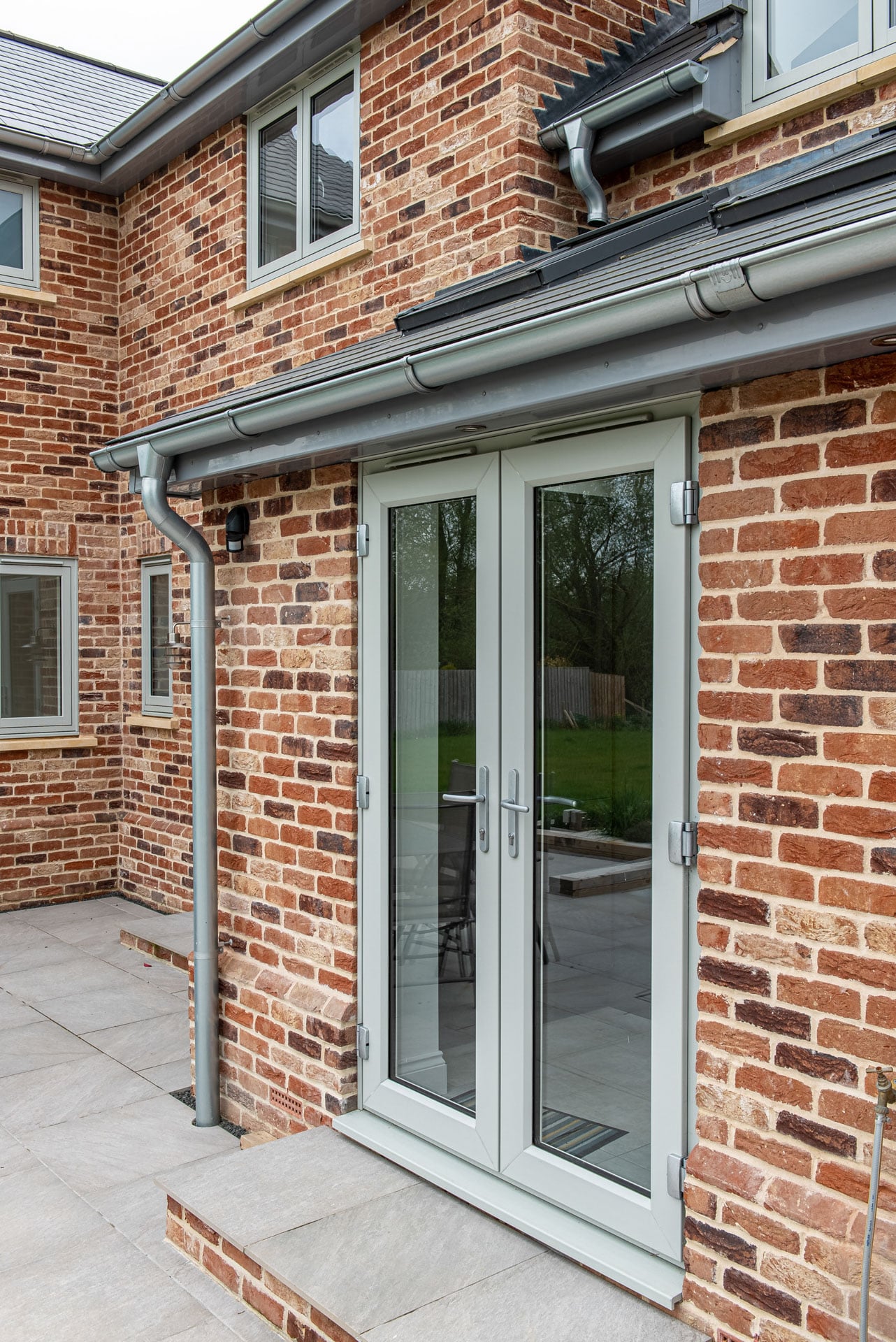 Interior look through Smarts bi-folding doors to the rear garden of a Suffolk home