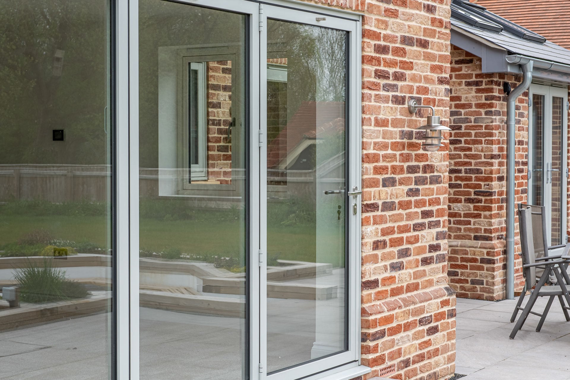 Agate grey uPVC picture window on red brick, Windows Etc Essex