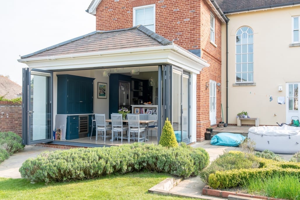 Origin bifold doors in anthracite with toning handles on an Essex kitchen extension