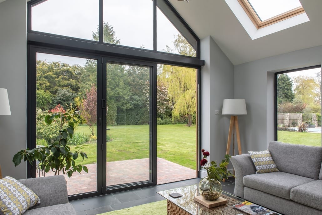 Aluminium bifold doors fully open to rear garden, One of Grey Gables Essex