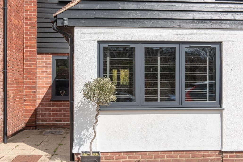 Grey flush casement window on white render, Windows Etc Essex