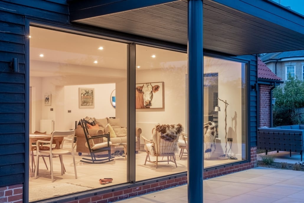 Rear elevation with Origin aluminium minimal sliding doors and estuary views