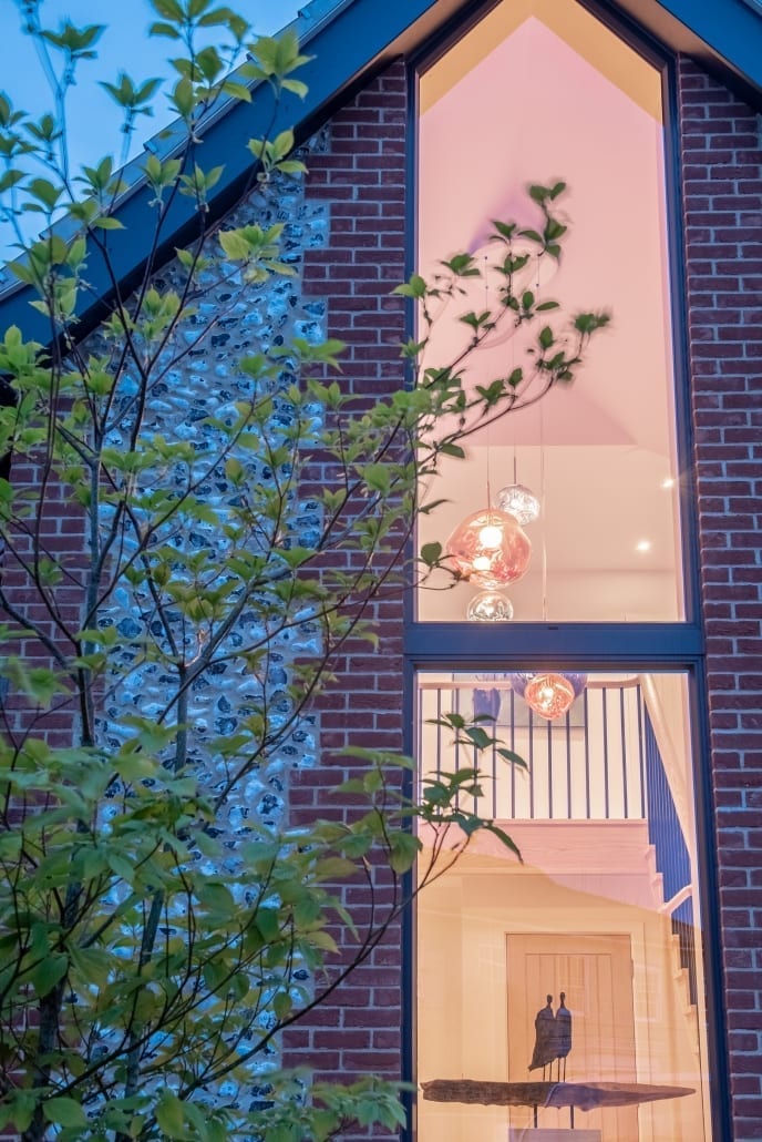 Tall Origin aluminium window in a brick elevation