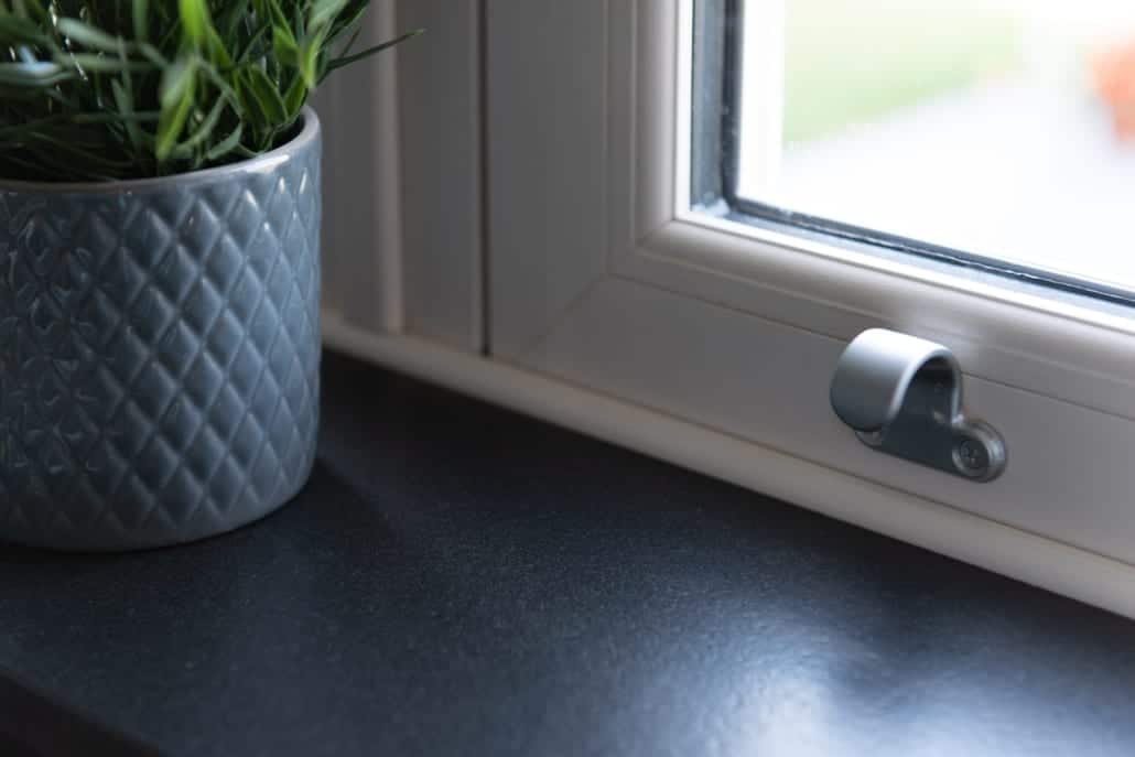 White uPVC window sill with plant, Windows Etc Colchester