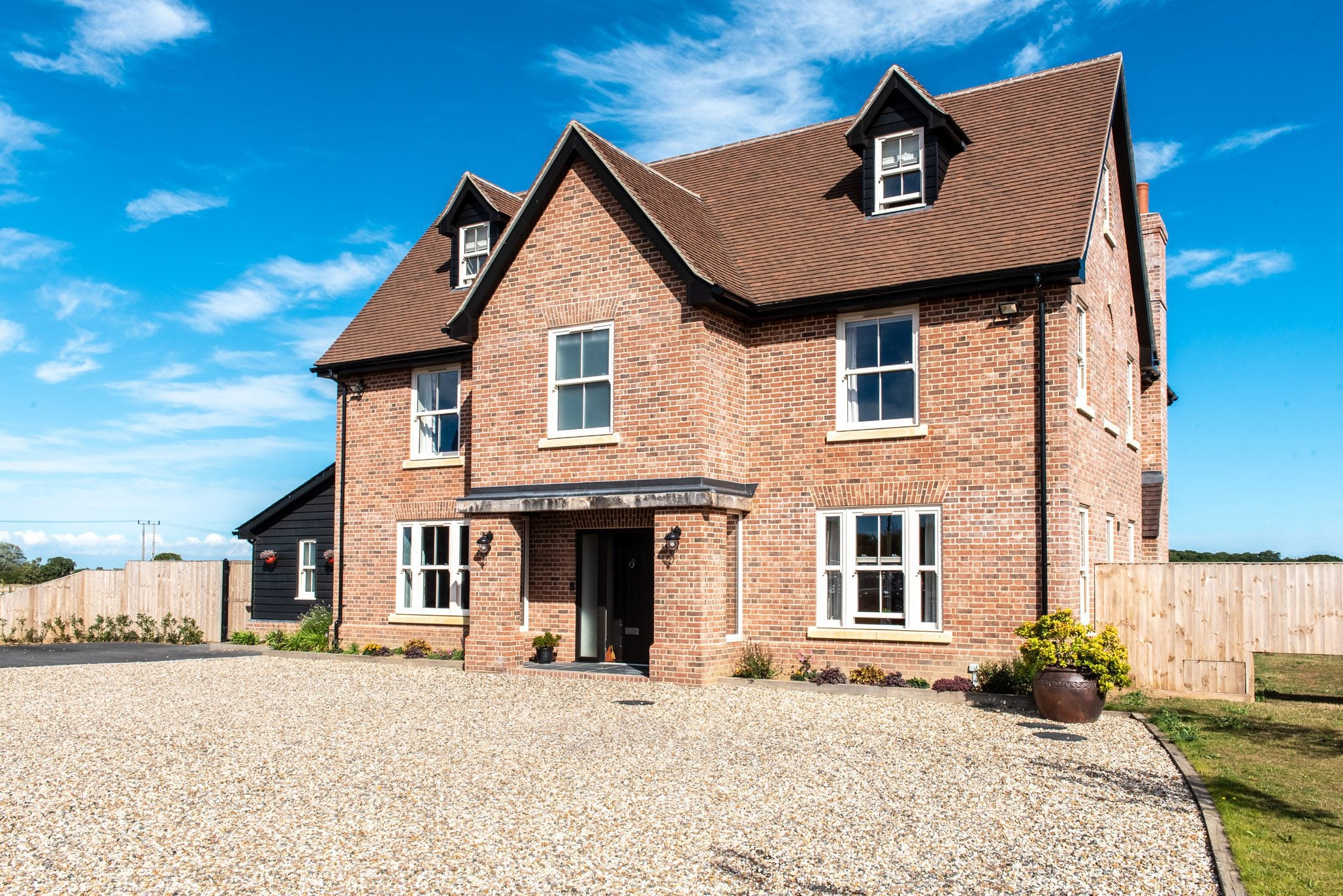 Roseview Heritage cream woodgrain vertical sliding sash windows on a North Essex farmhouse