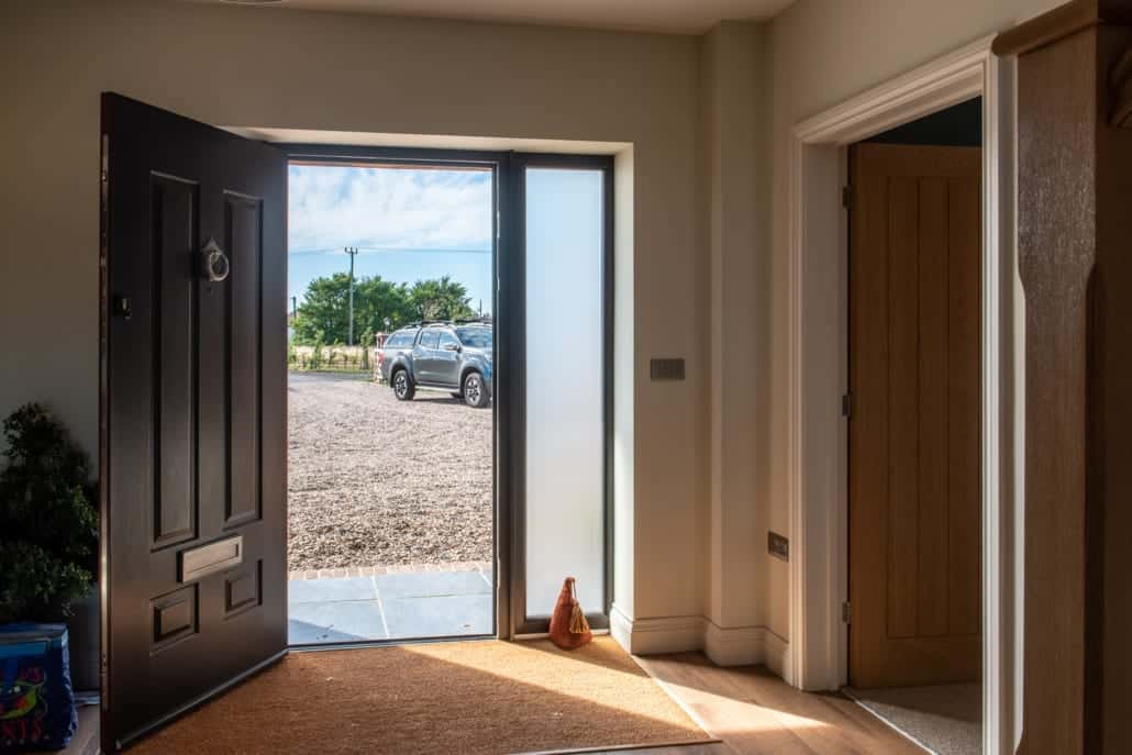 Aluminium bifold door track and threshold detail on farmhouse project