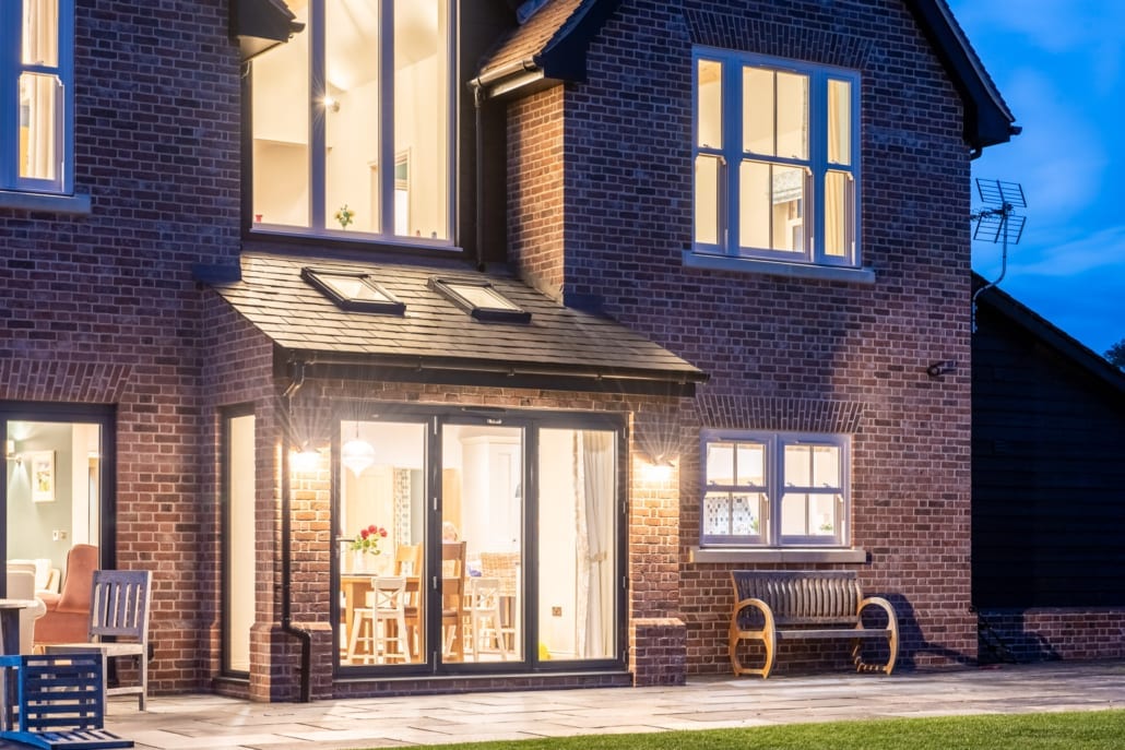 Wide view of North Essex farmhouse rear with Smarts bifold doors