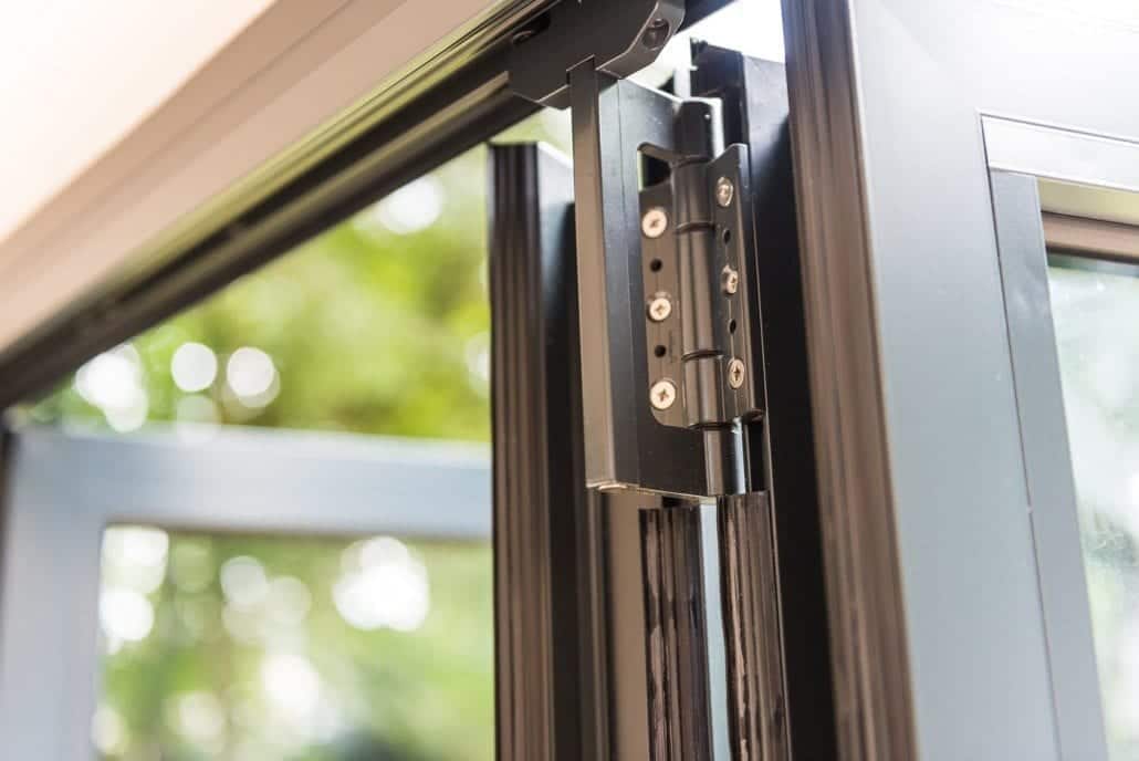Smarts bifold doors swept back in three sections with fourth as access door