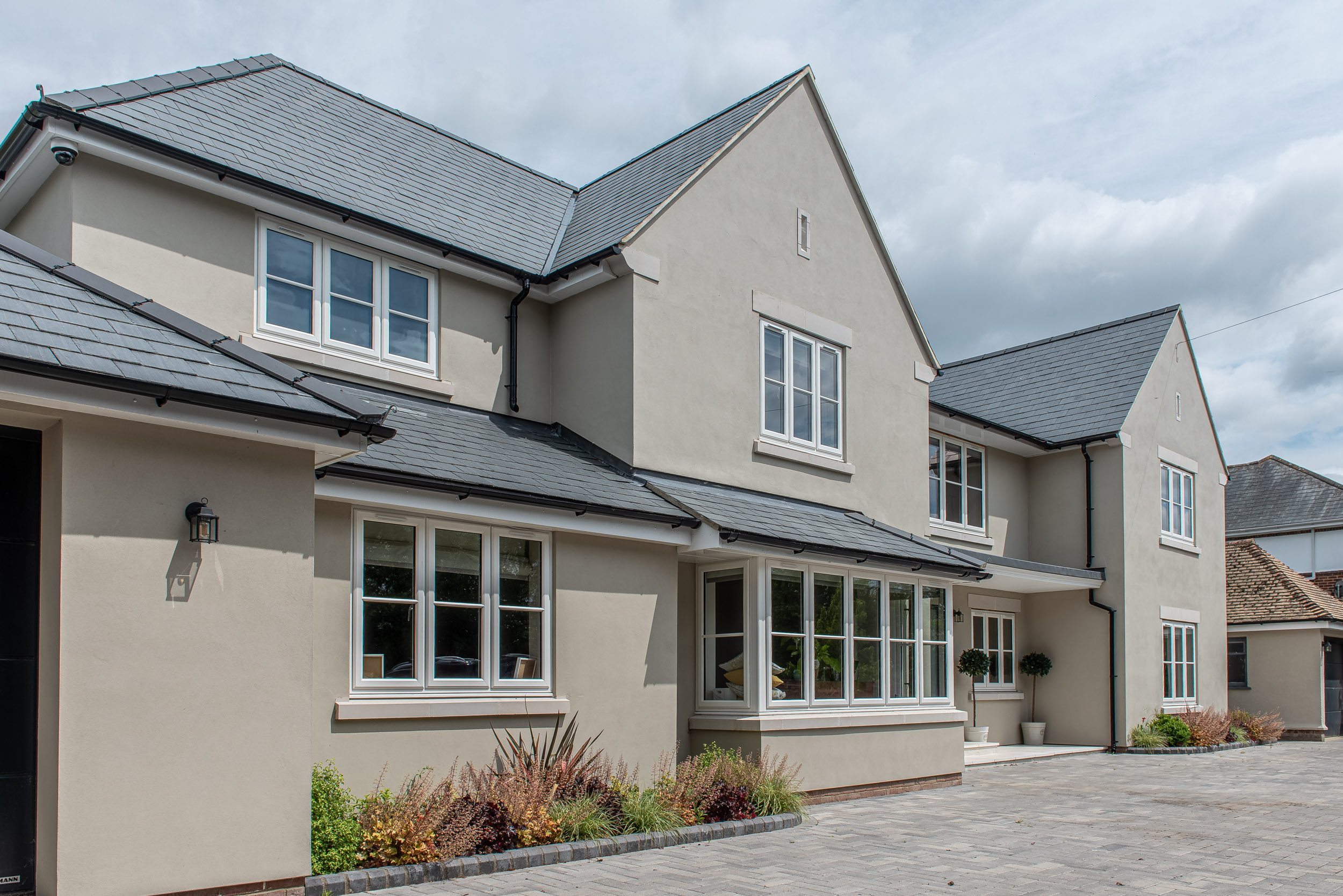 Rendered home with grey casement windows, North Colchester Essex