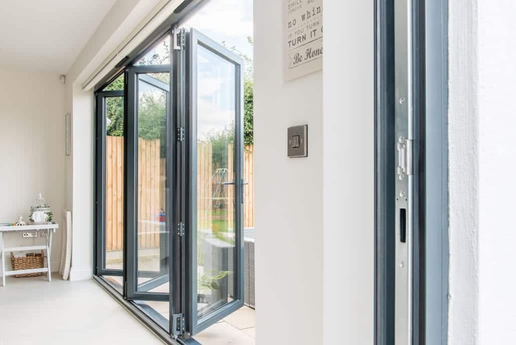 Wide view of rear elevation with bi-folding doors and Juliette balcony above