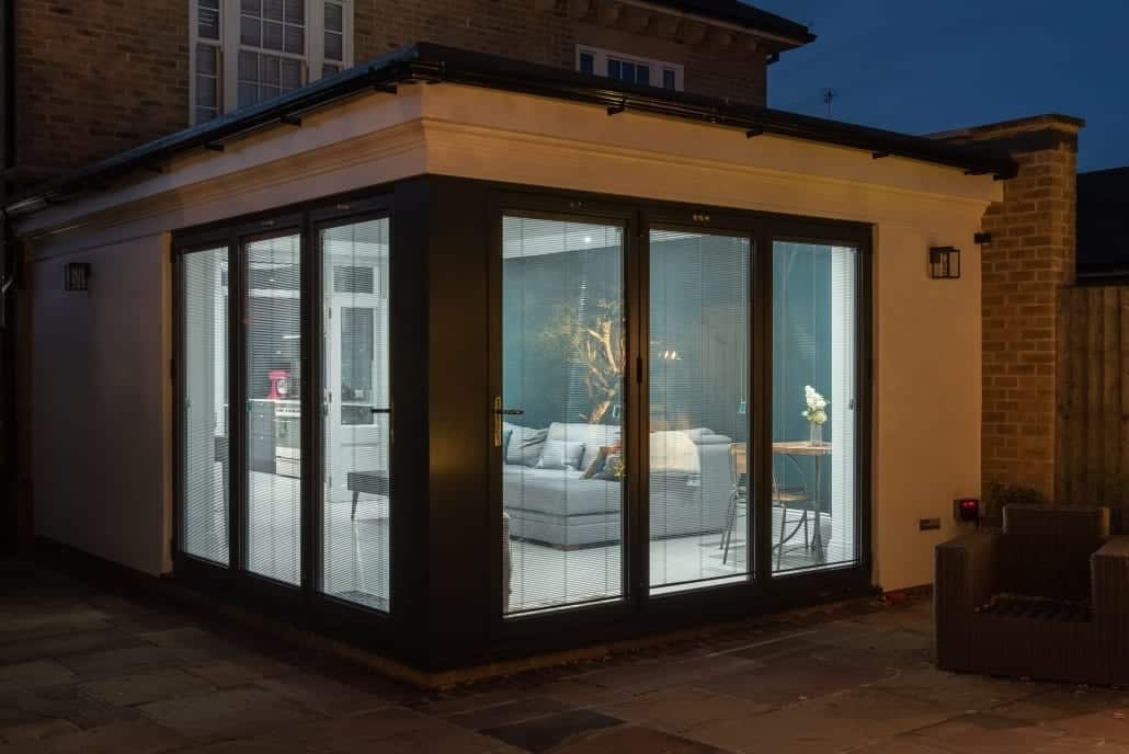 Night-time view of bifold doors and lantern roof, Colchester