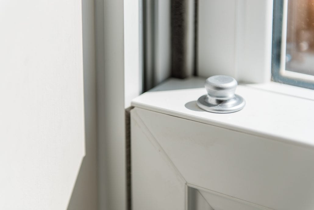 Front door glazed side panels flooding the hallway with natural light