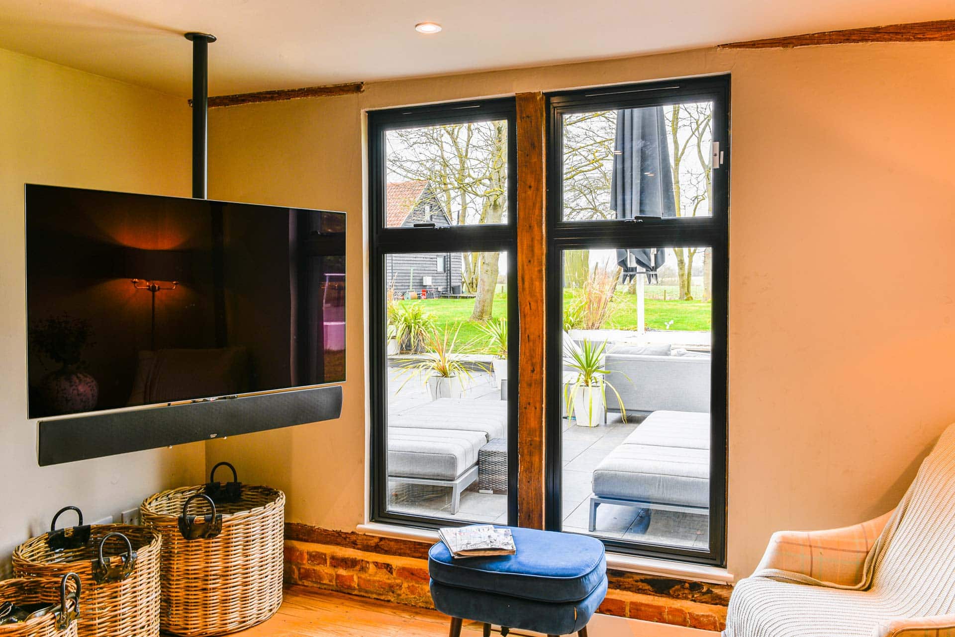 Full-height Heritage 47 windows in seating area with aged timber contrast