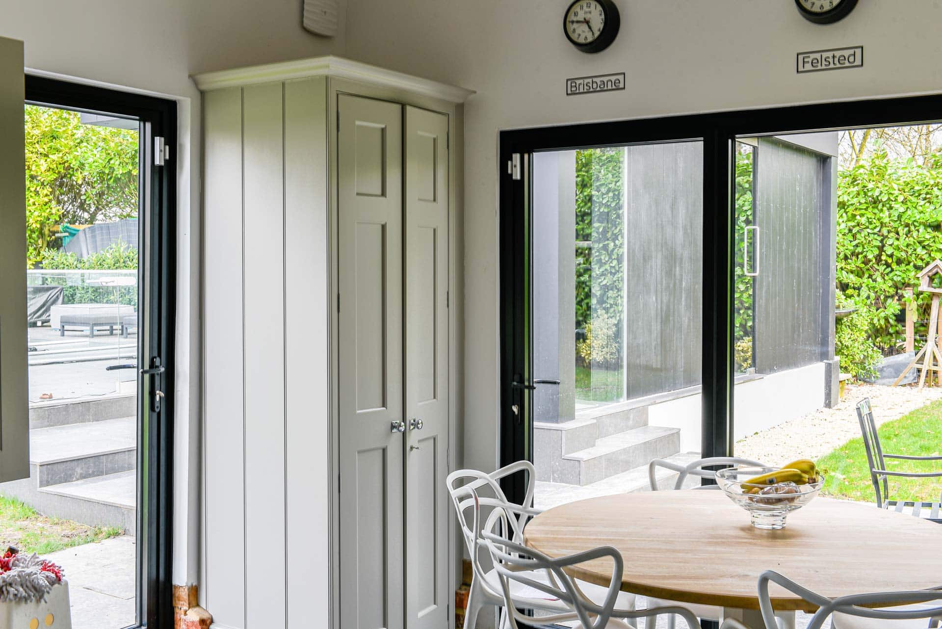 Smarts bifold doors open to outdoor space from kitchen