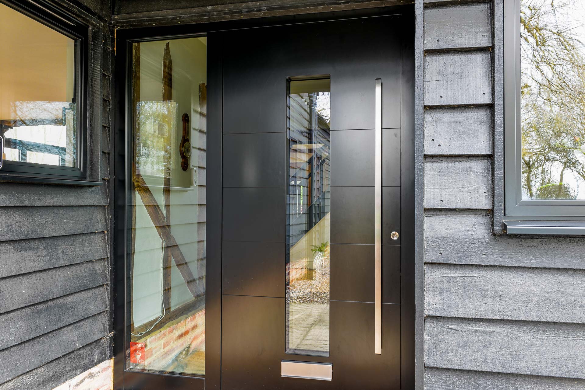 Spitfire aluminium front door with long bar handle, Essex installation