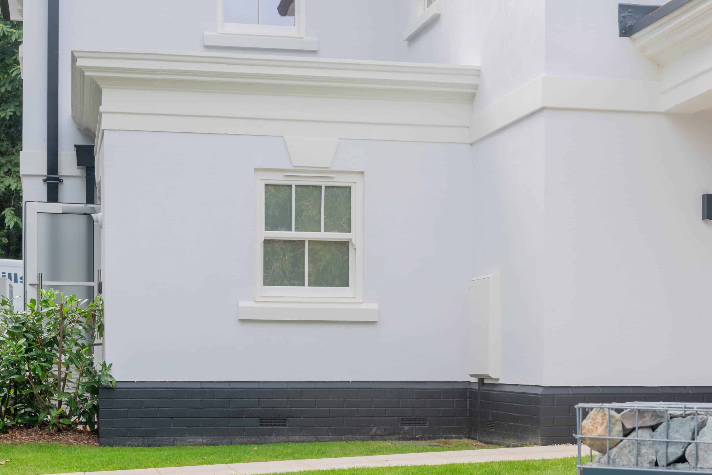 Exterior view of the Kesgrave Hall gatehouse showing Heritage uPVC vertical slider windows