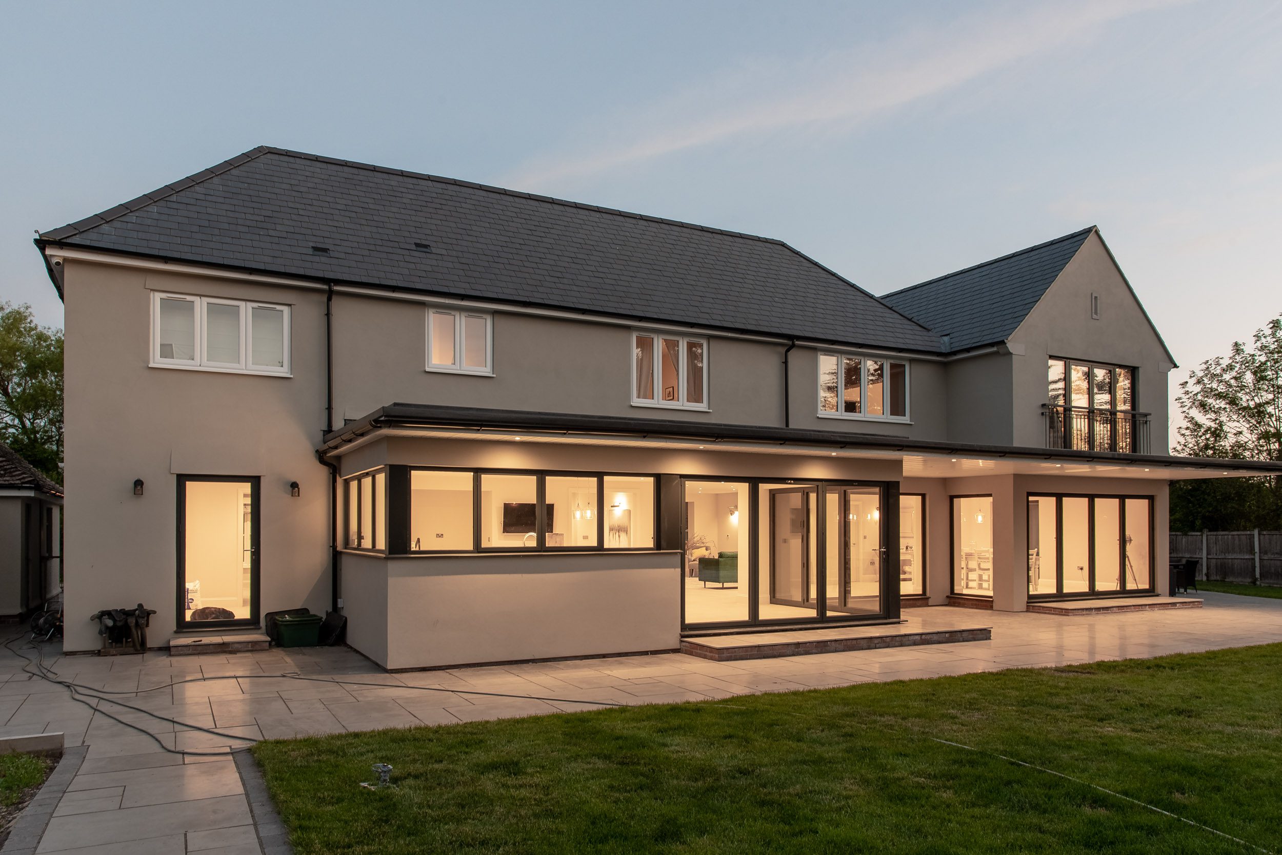 Interior view of open-plan living space with floor-to-ceiling glazing