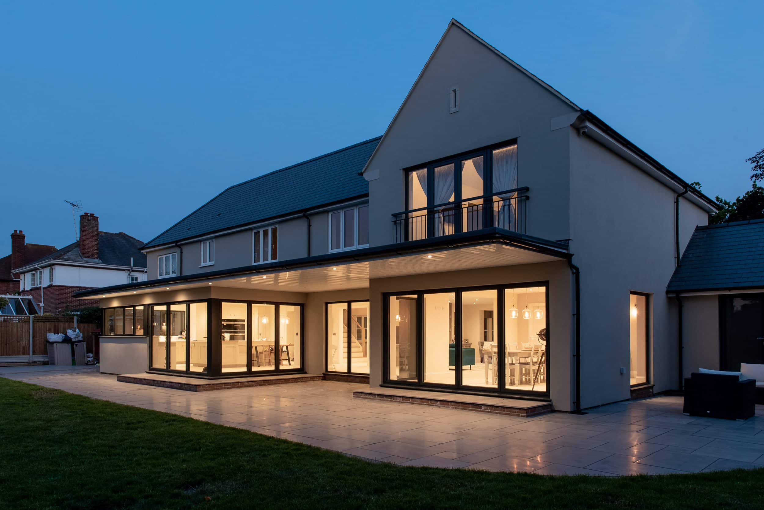 Smarts 1000 bifold doors open in a 3-3-0 corner arrangement revealing the garden
