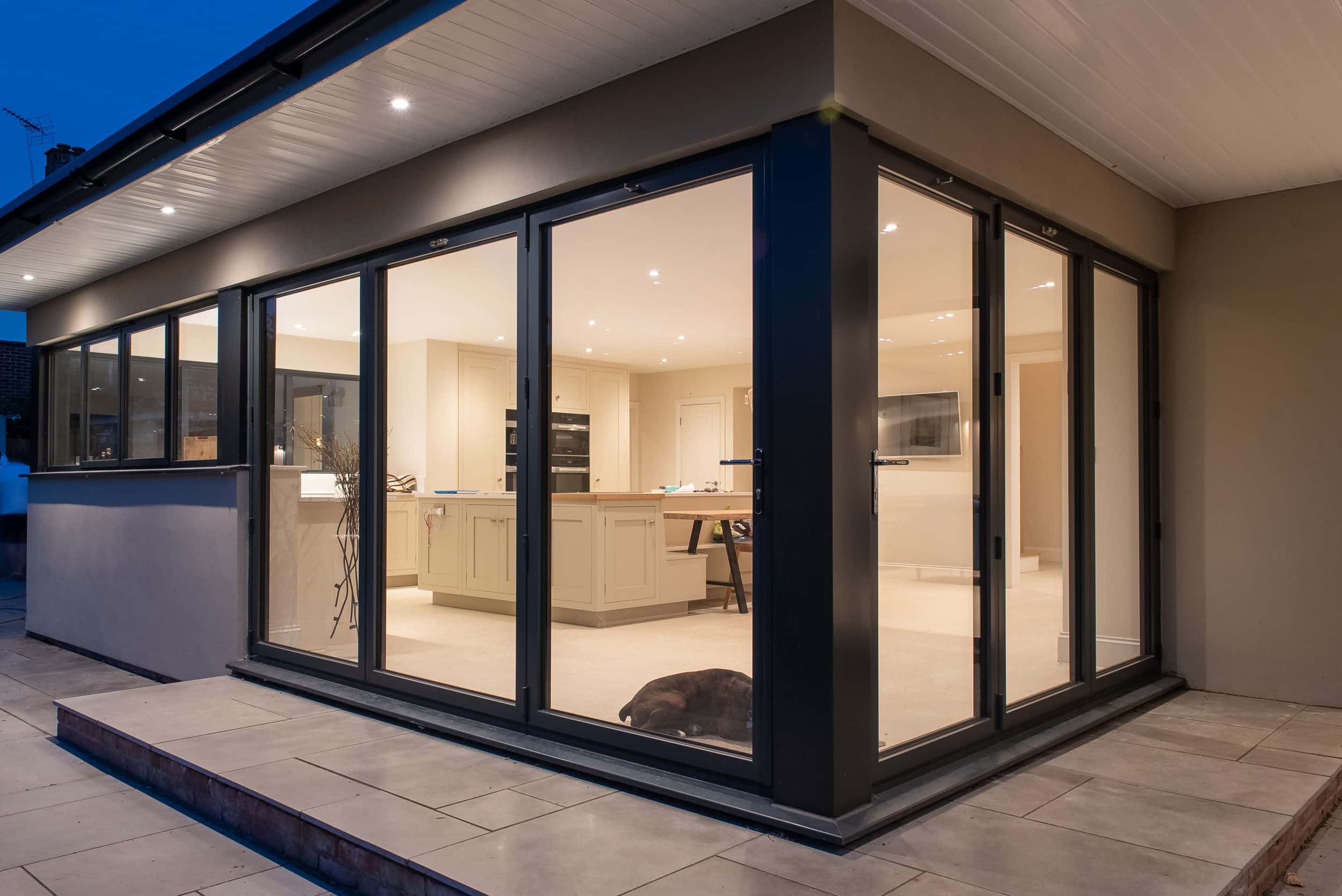 Rear elevation showing Smarts bifold doors and glazed corner configuration