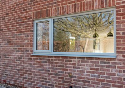 Living room three-panel Smarts bifold doors opening to garden