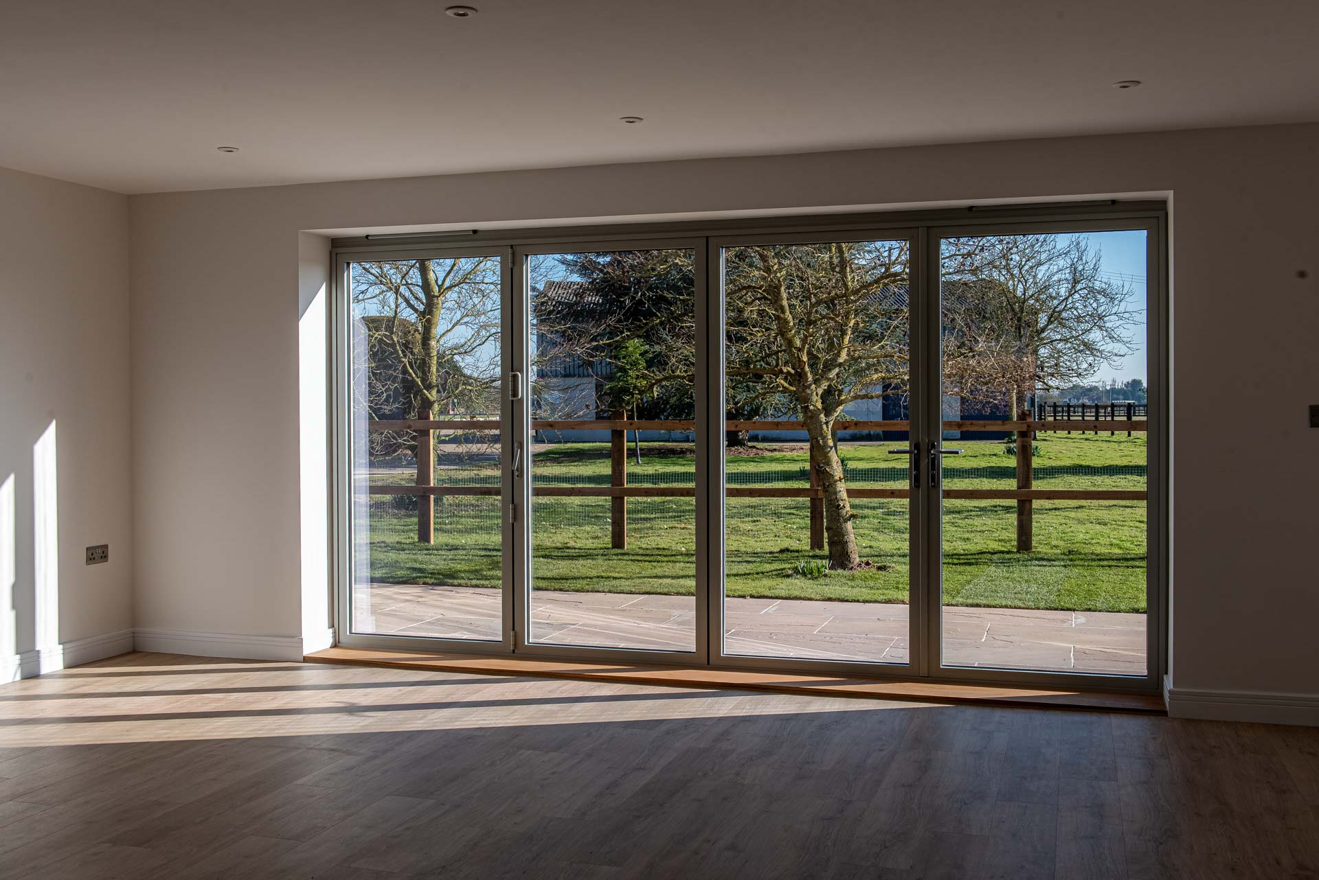 Agate Grey uPVC stormproof casement windows on farmhouse side elevation