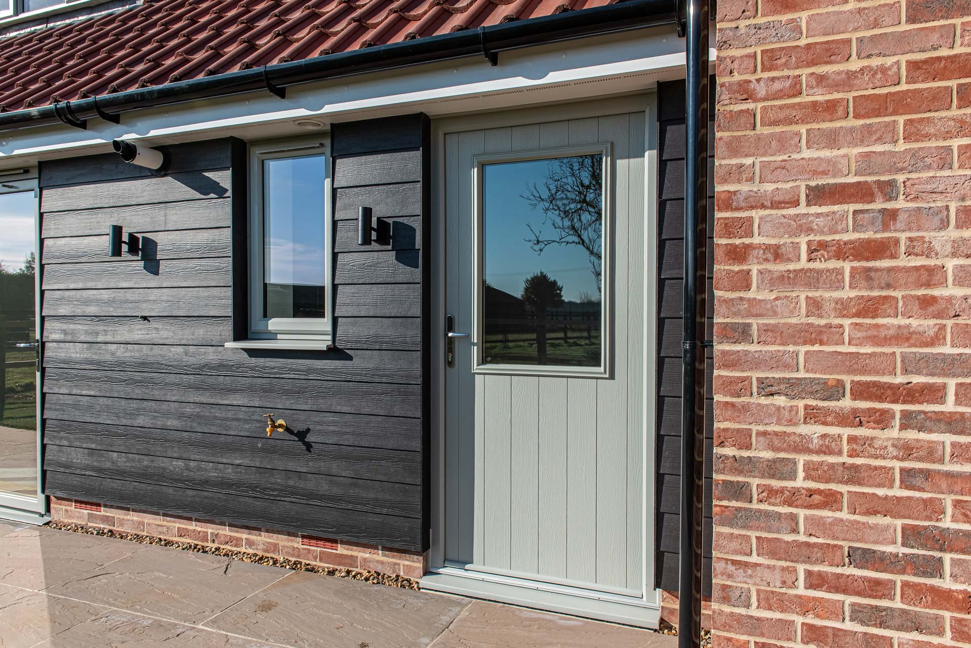 4-1-3 bifold door configuration in kitchen-diner opening to garden