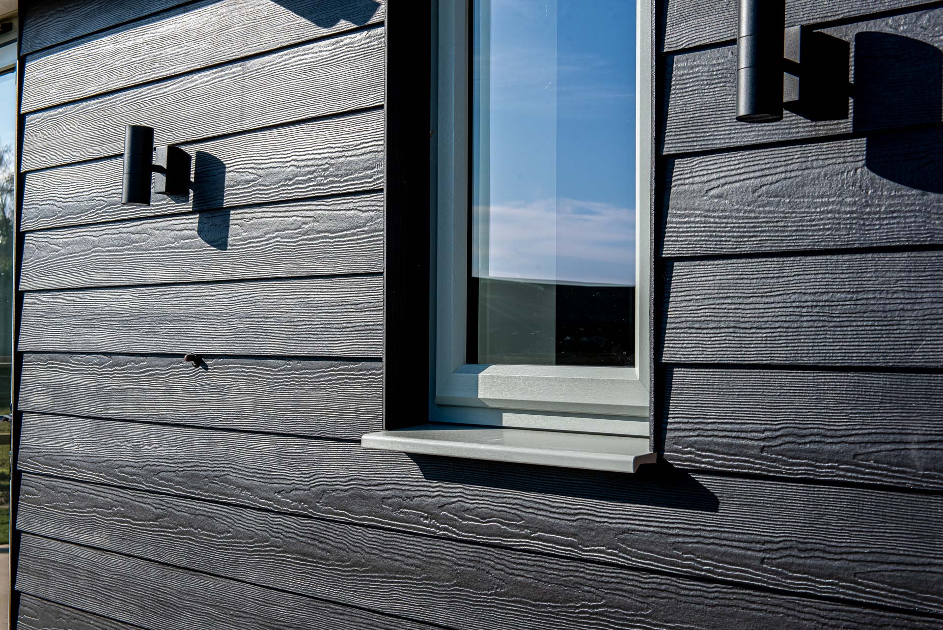 Agate Grey stormproof uPVC windows on new-build farmhouse exterior